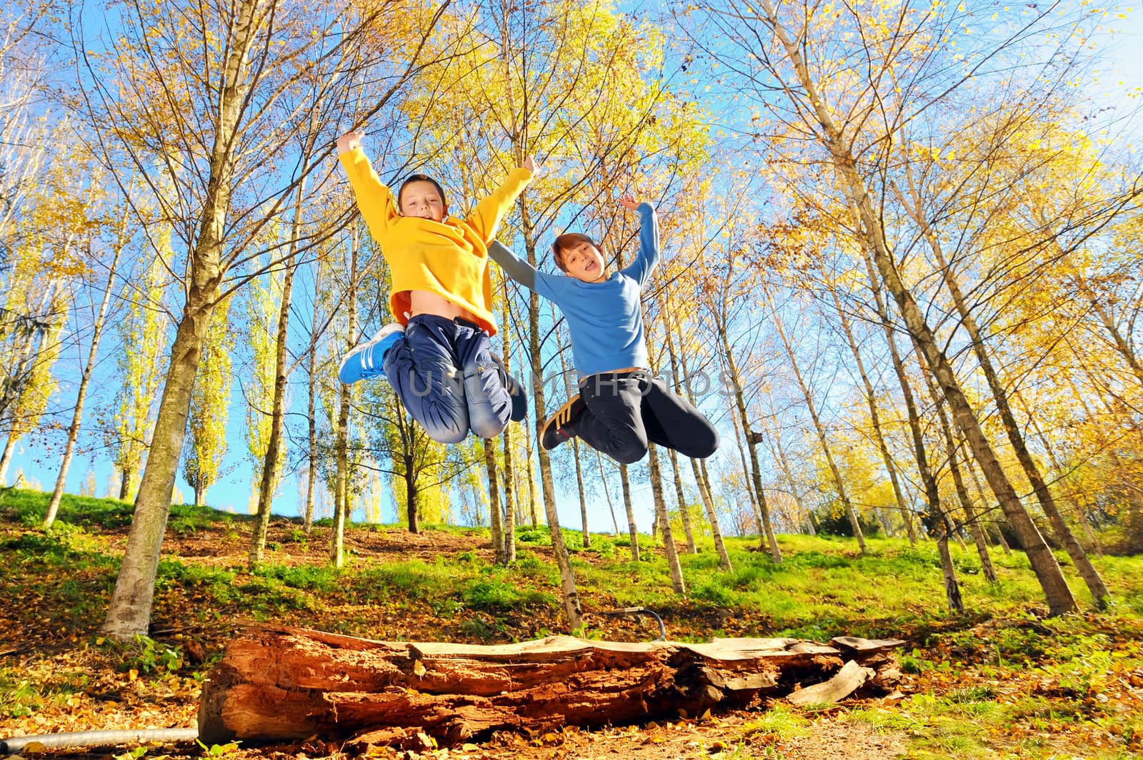 two boys jumping