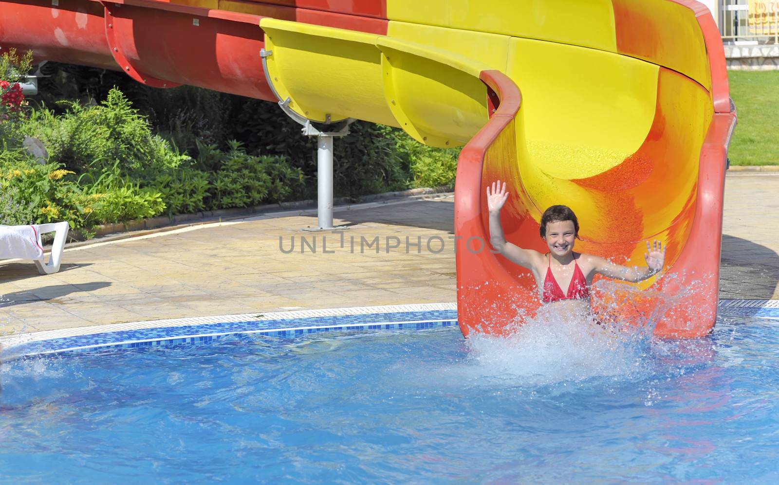 girl in the pool water slide 