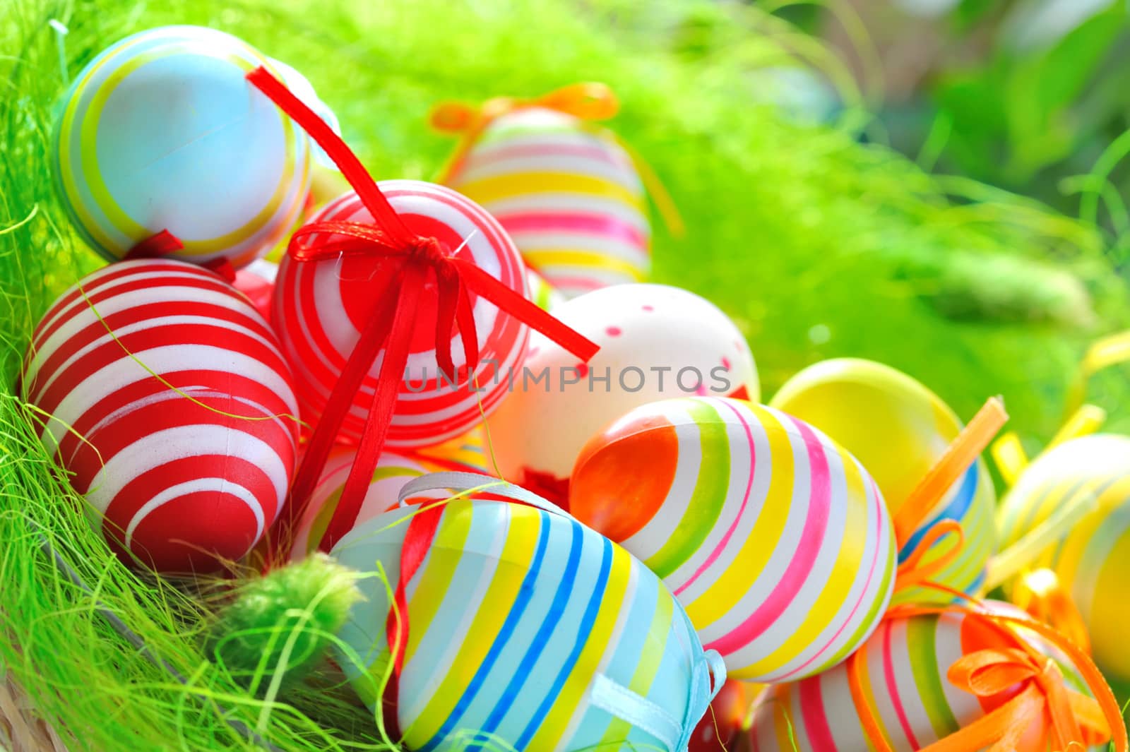 Colorful painted easter eggs in basket 