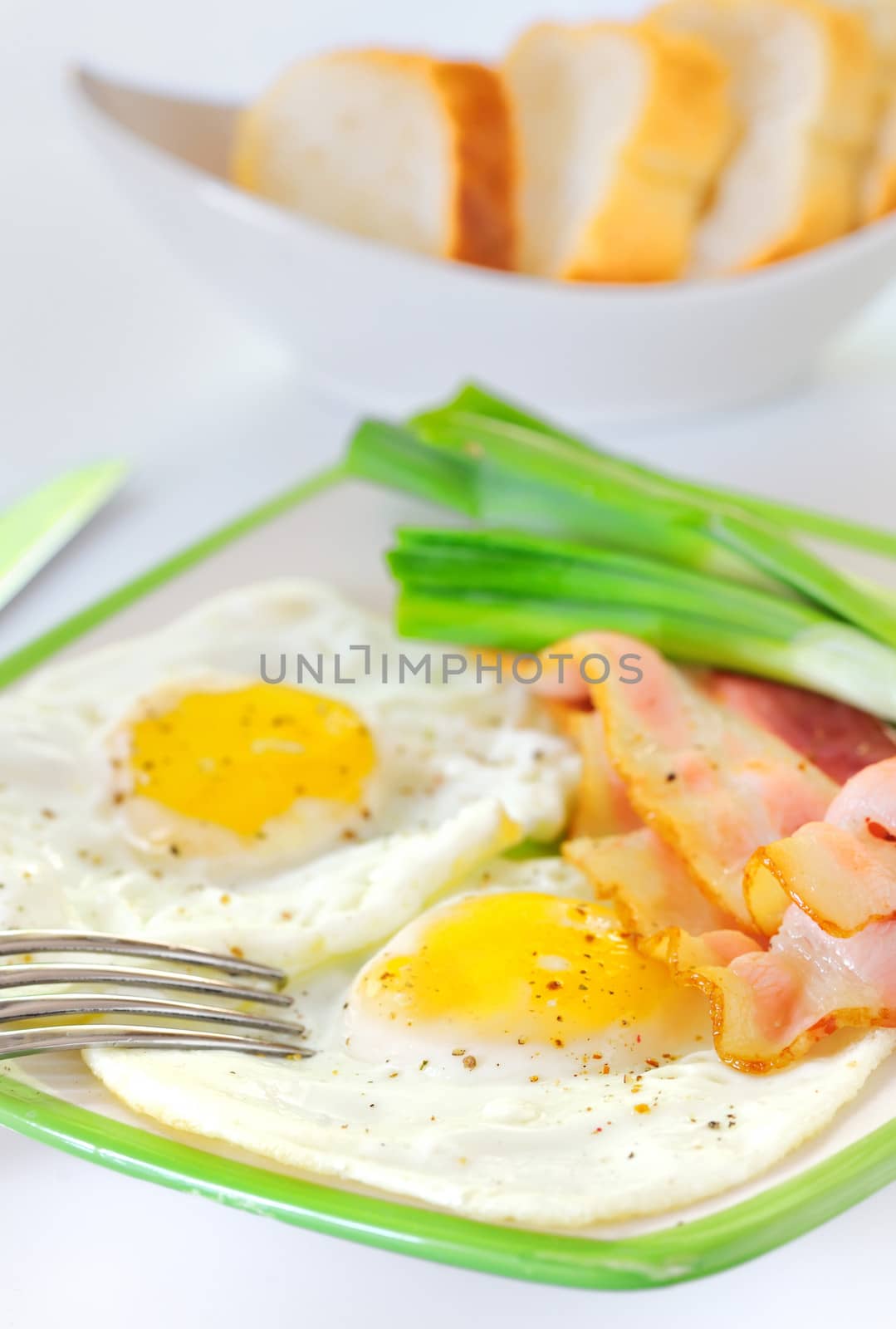 breakfast with bacon and fried eggs 