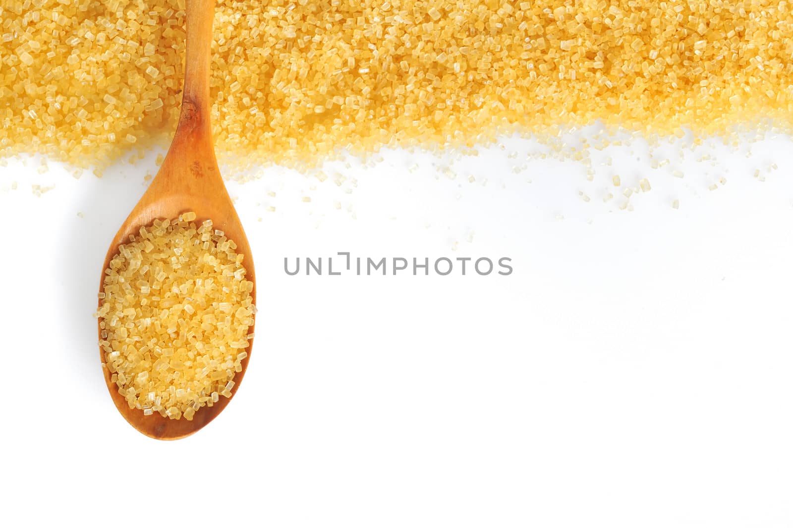 spoon and cane sugar on white background