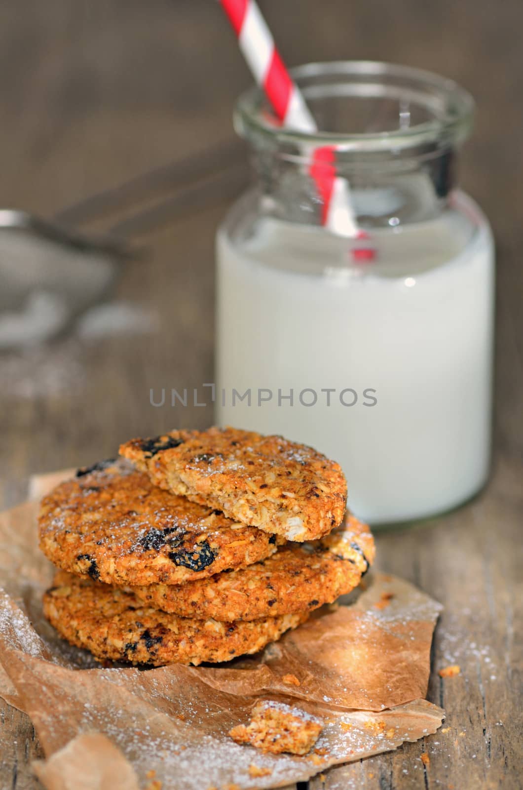 dietetic biscuits and milk on a wood bakground