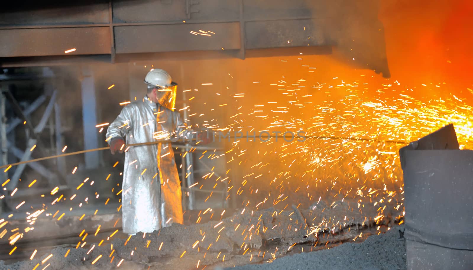 mill worker with hot steel