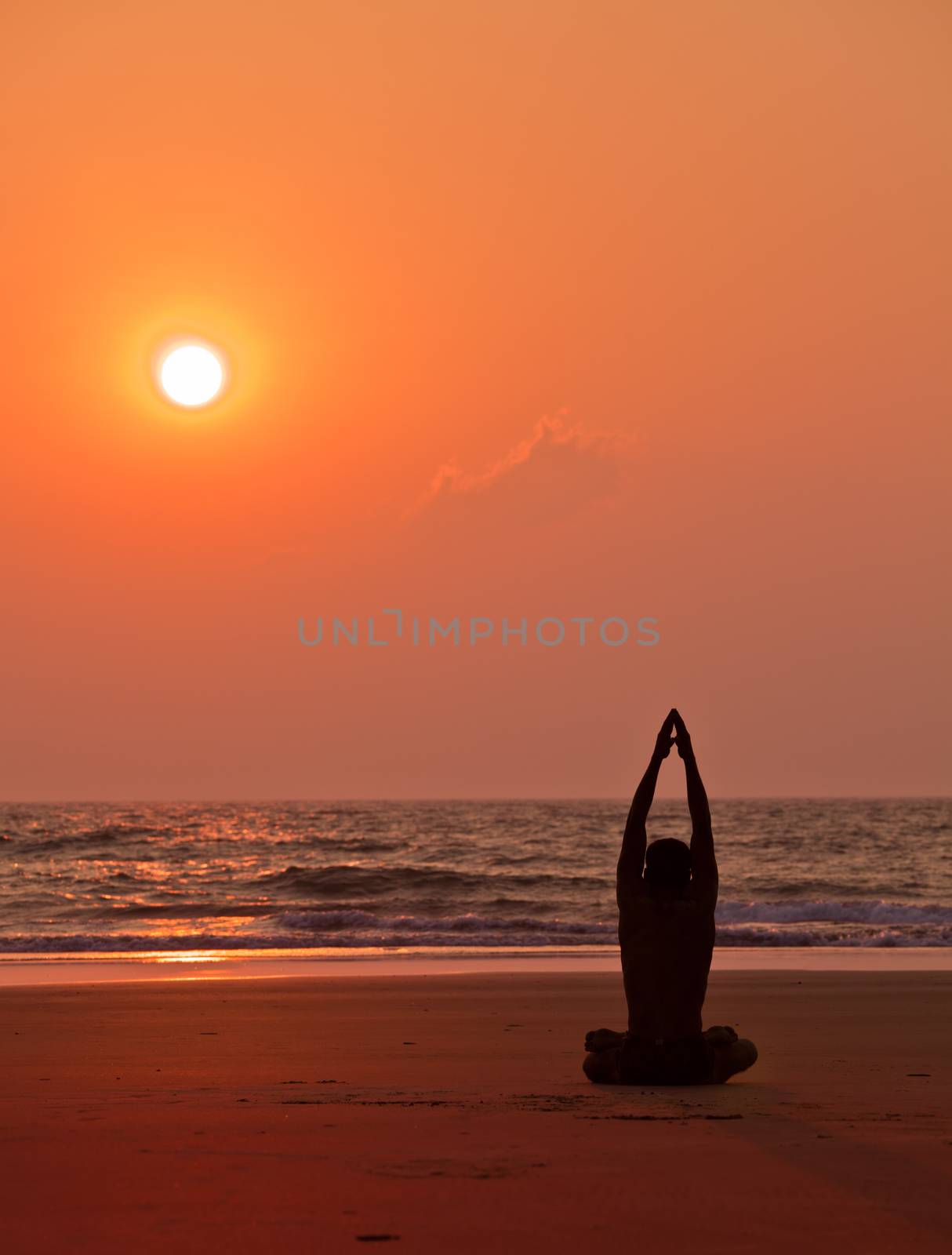 Yoga exercises at sunset  Man s silhouette by vicdemid
