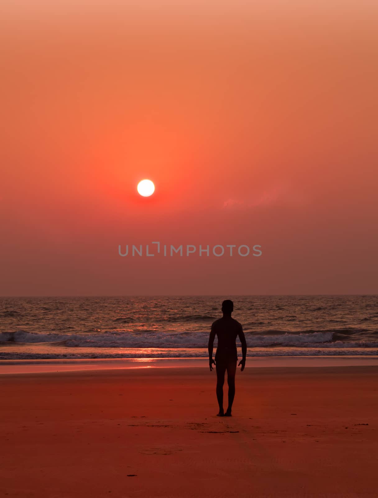 Yoga exercises at ocean sunset  Man s silhouette Tadasana by vicdemid
