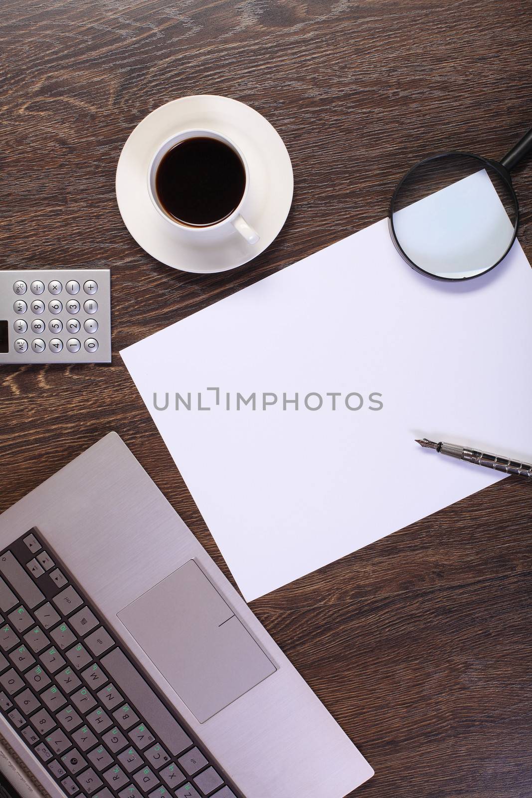 Business papers and a cup of coffee on the table