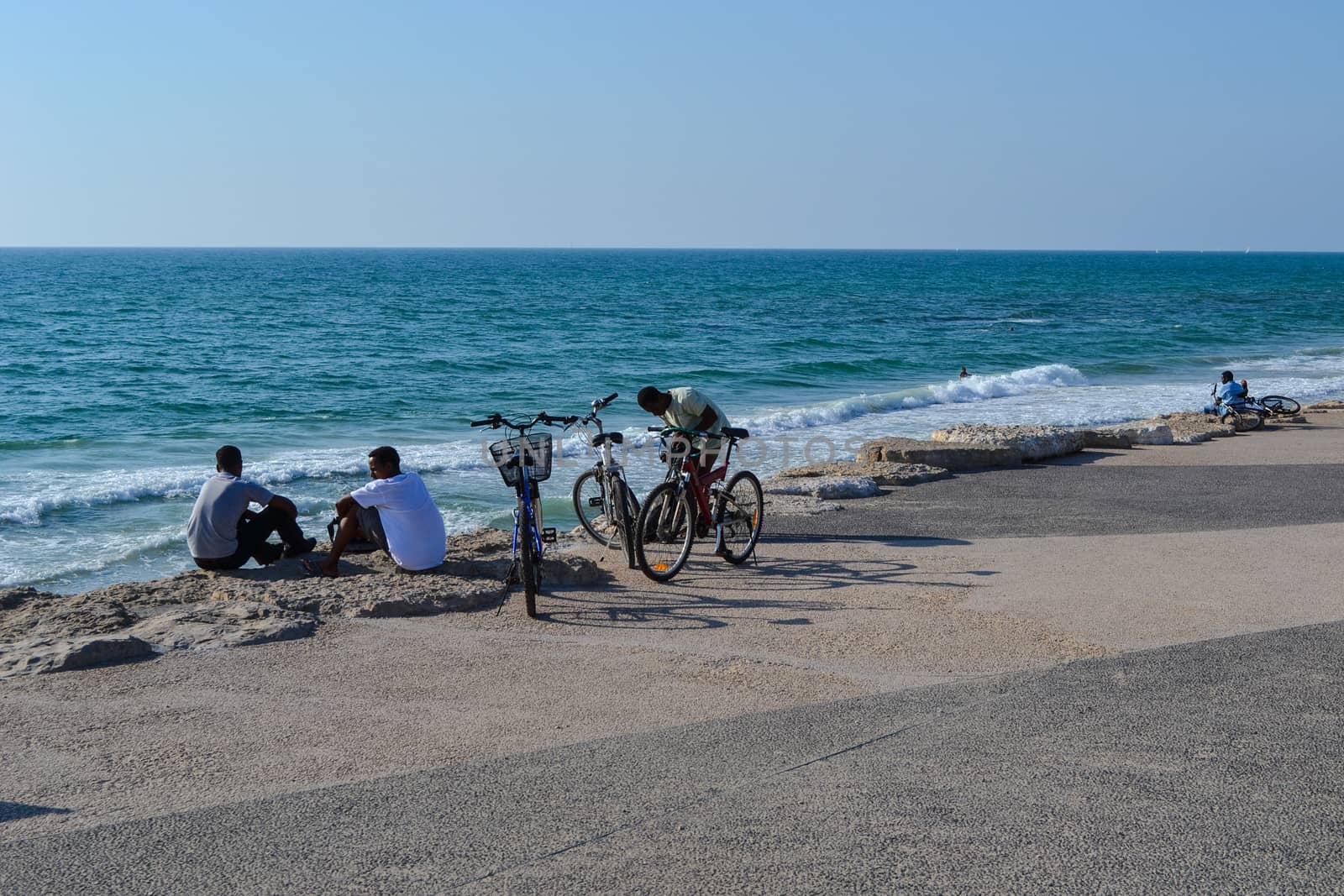 Young men on the Tel Aviv beach