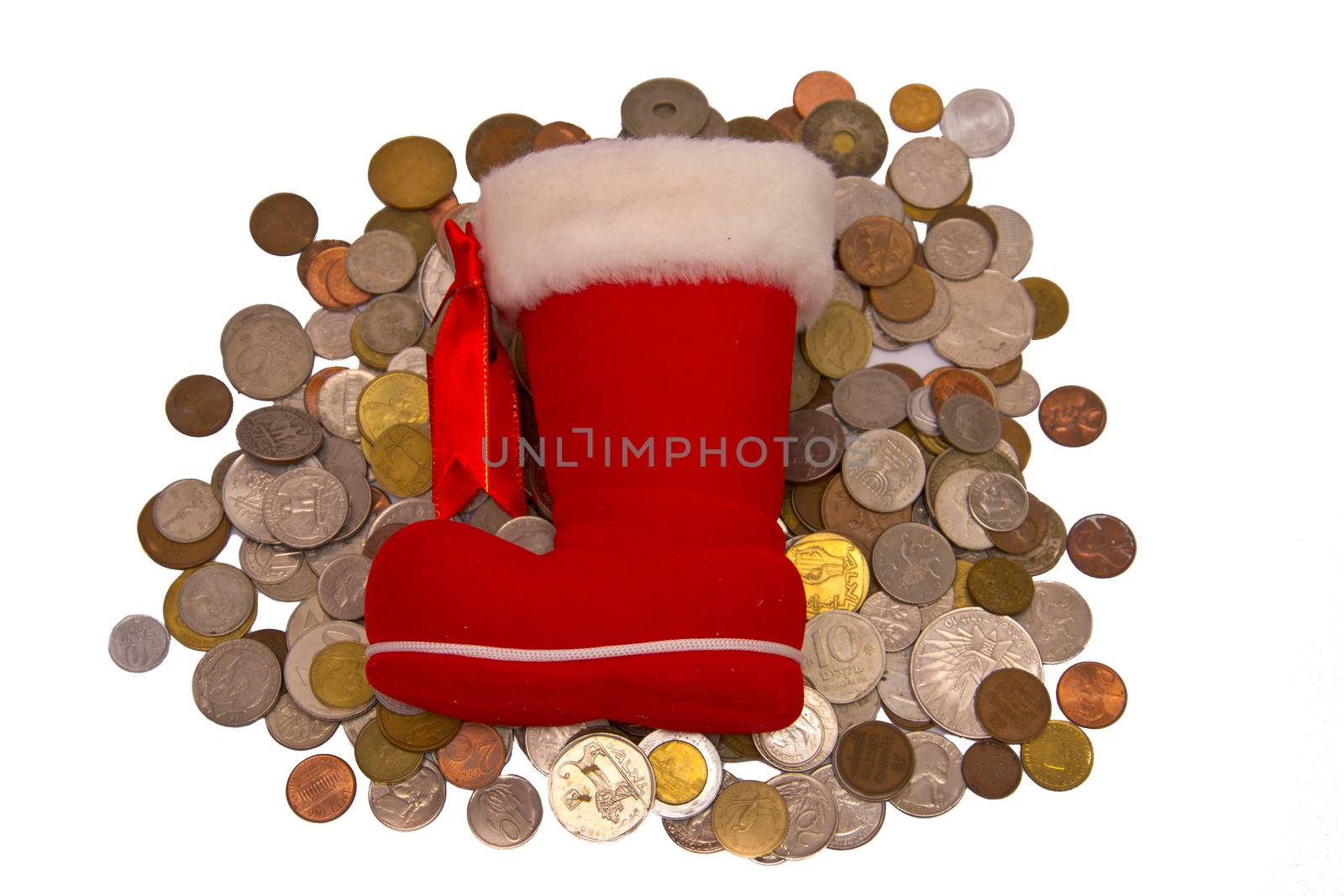 Old and new metal money and a red boot solated on white background