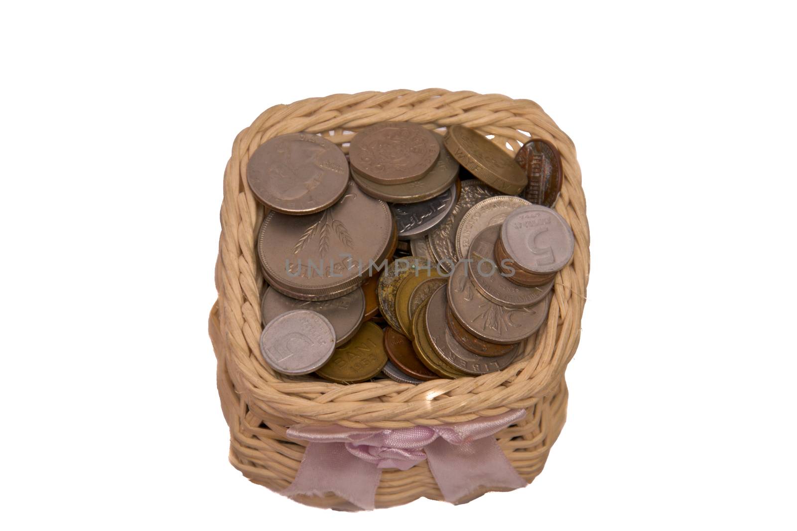 Wooden vase with metal money isolated on a white background.