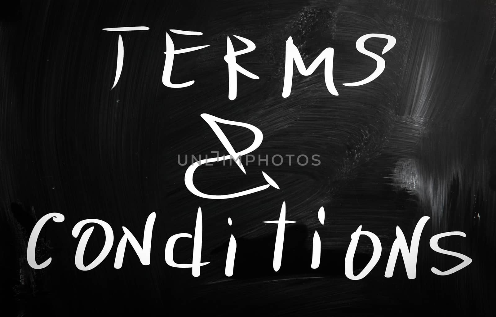 "Terms & Conditions" handwritten with white chalk on a blackboard