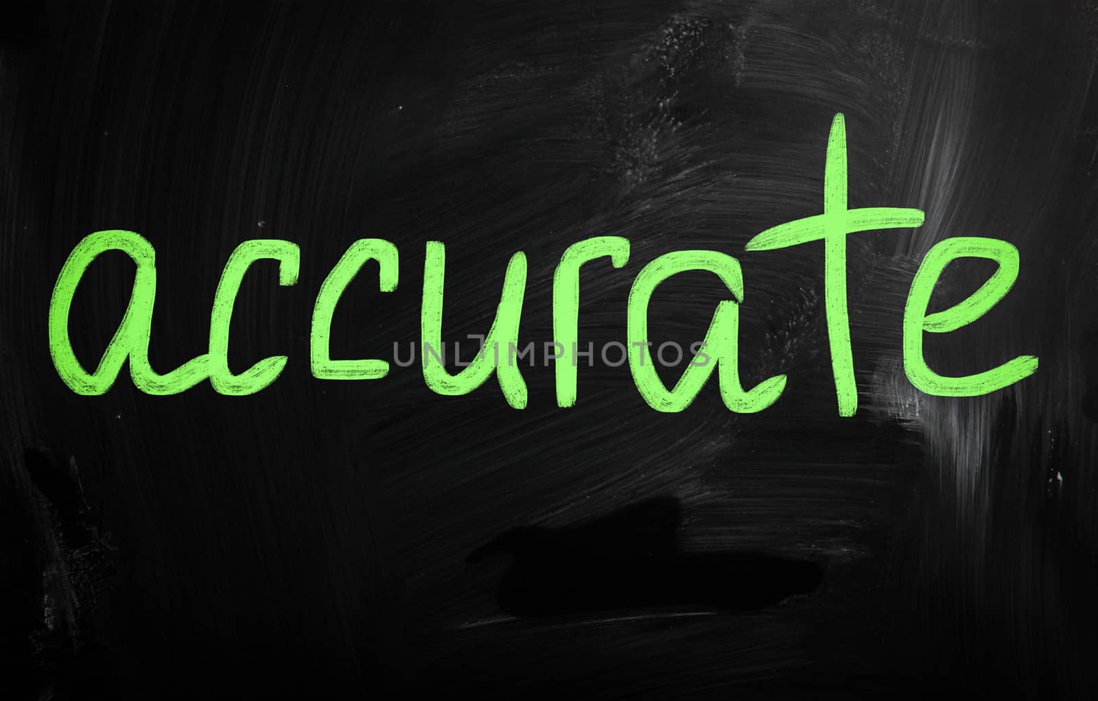 "Accurate" handwritten with white chalk on a blackboard