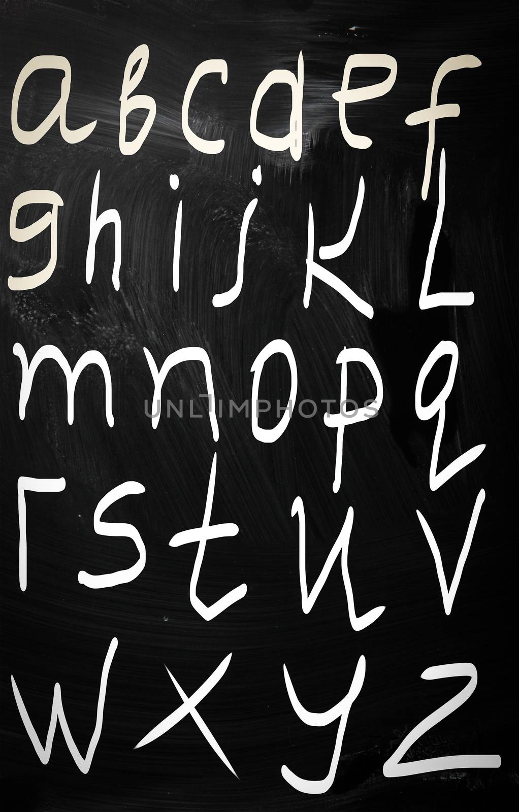 Complete english alphabet handwritten with white chalk on a blac by KrasimiraNevenova