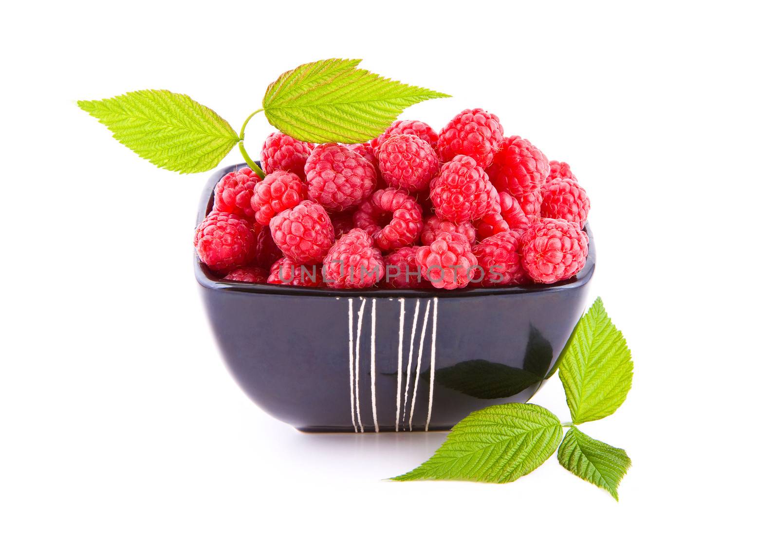 Raspberries in a bowl by Gbuglok