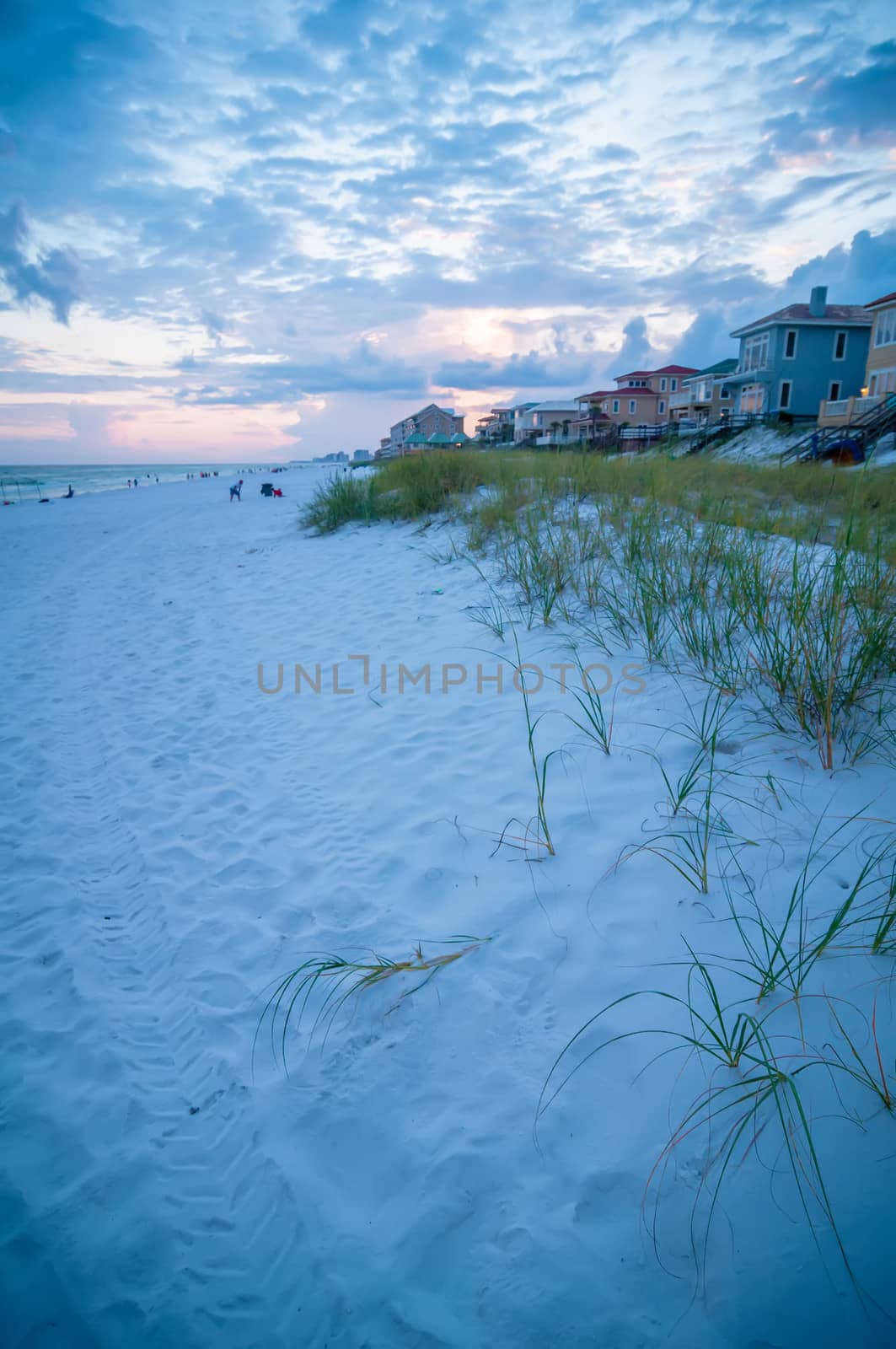 sunset on florida beach with white sand and blue sky