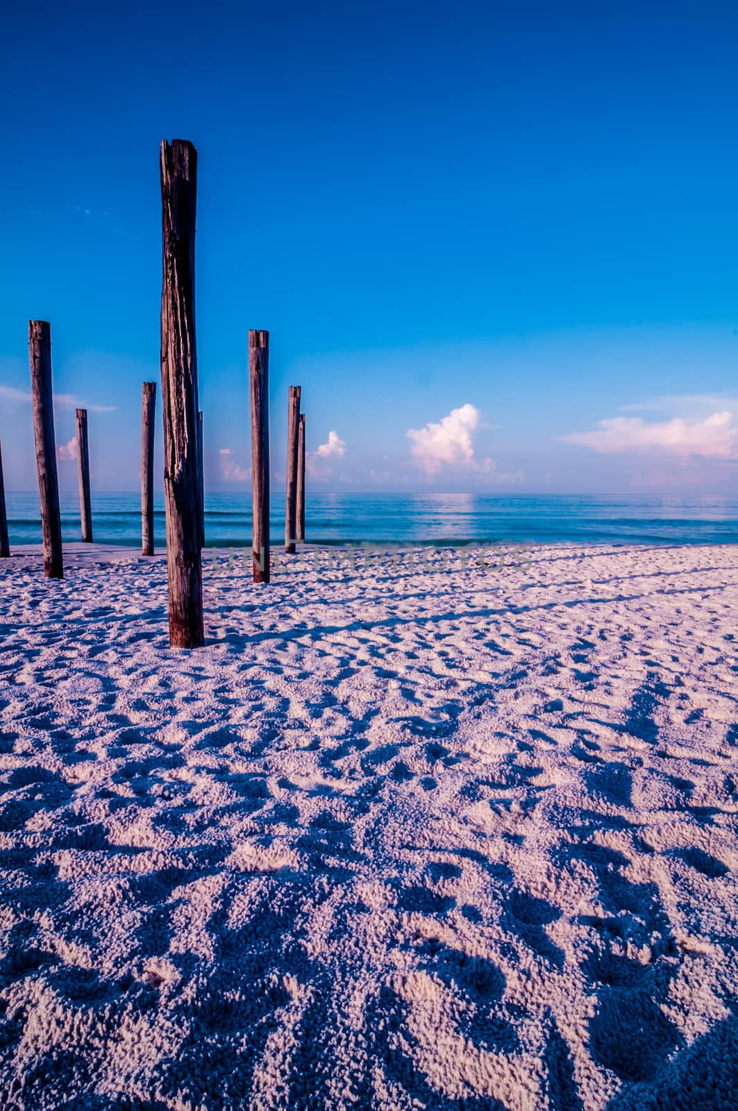 old sea pier ruins on the beach by digidreamgrafix