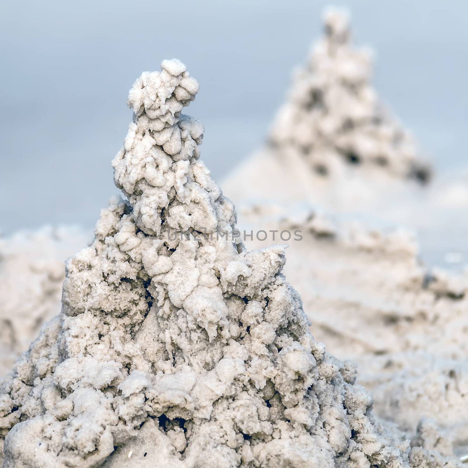 sand castle structures built at seashore beach