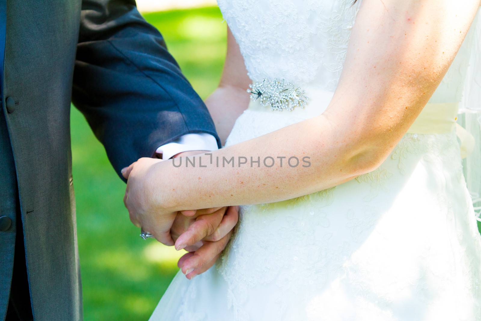 Bride and Groom Hands by joshuaraineyphotography