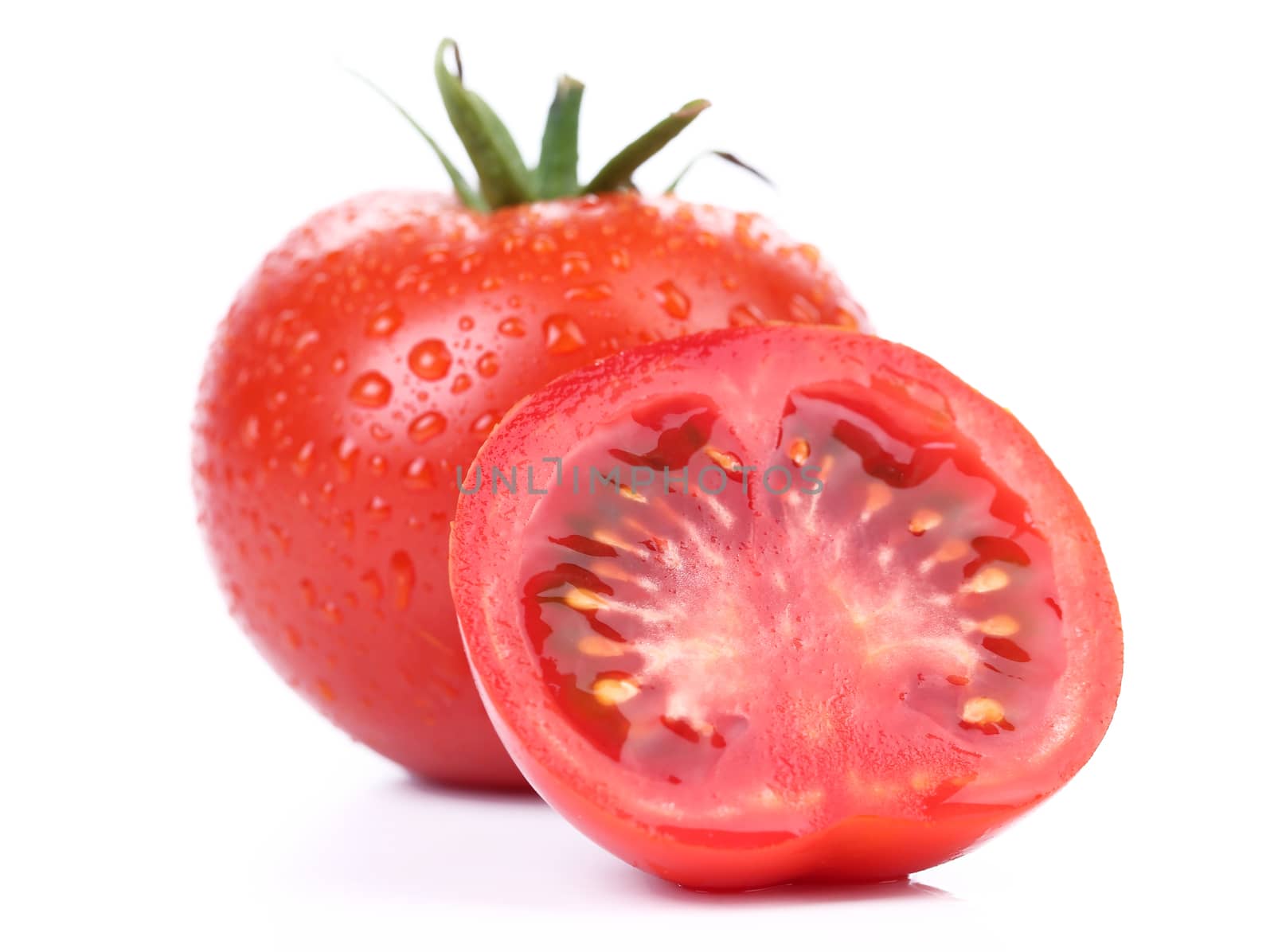 red tomato vegetable with slice isolated on white background