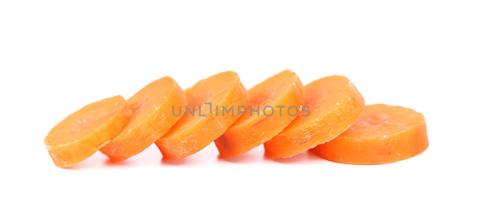 Raw carrot slices on a white background by indigolotos