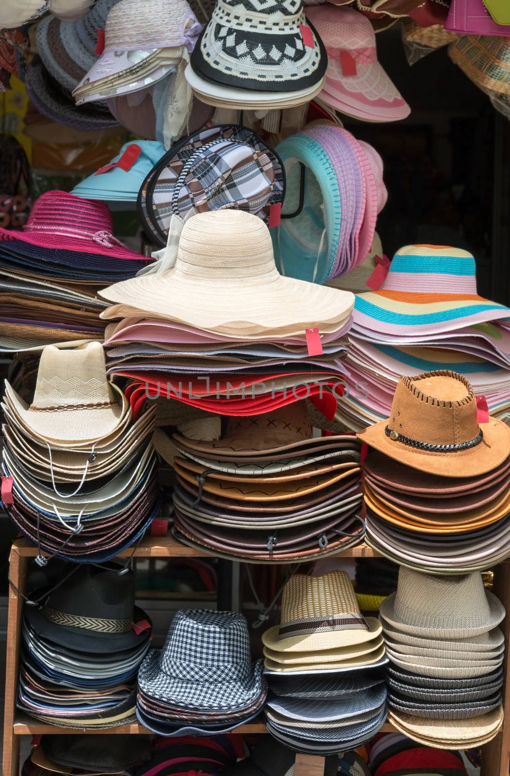 Varied fashion hats showcase on open market shop 