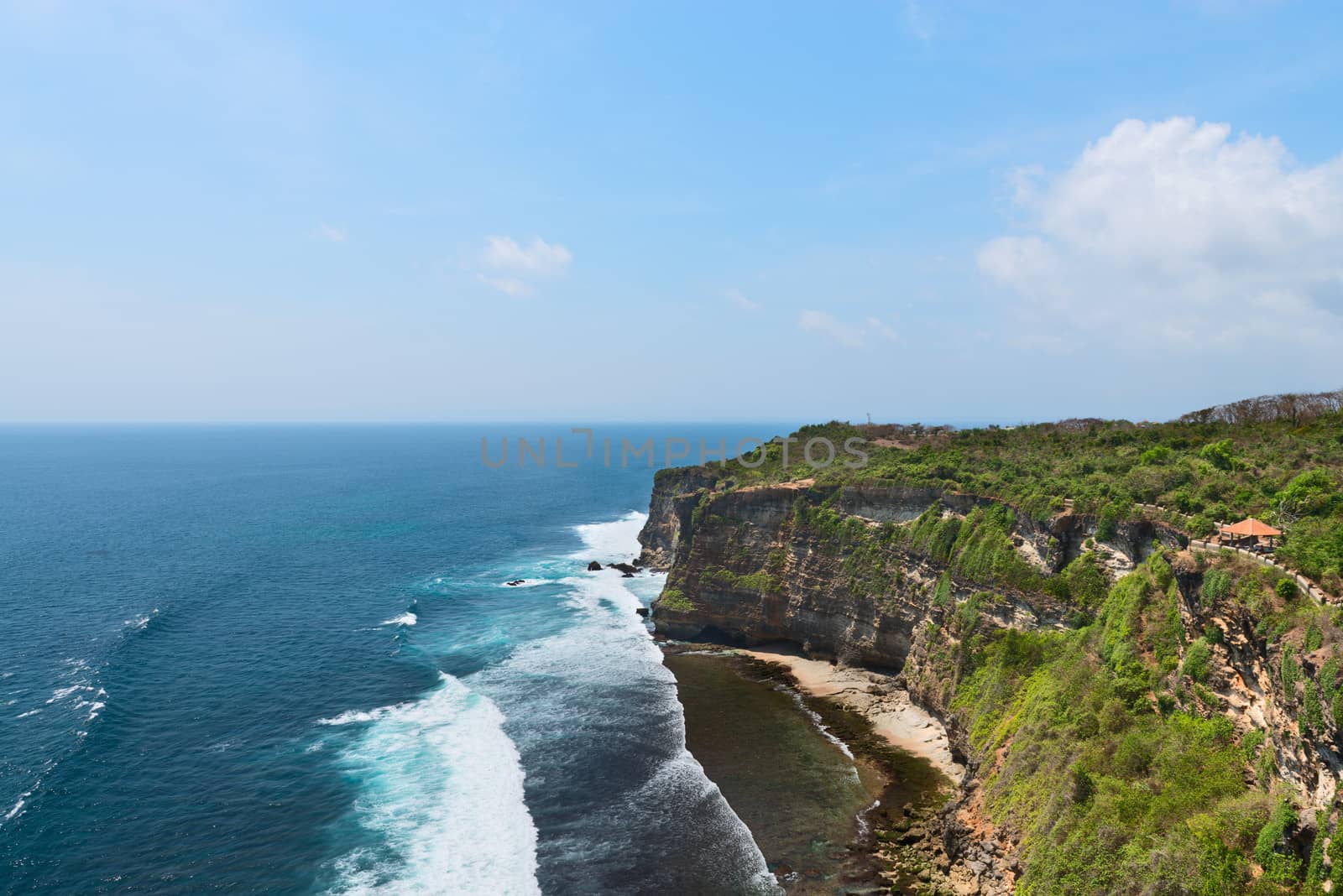 Cliffs above blue tropical sea by iryna_rasko