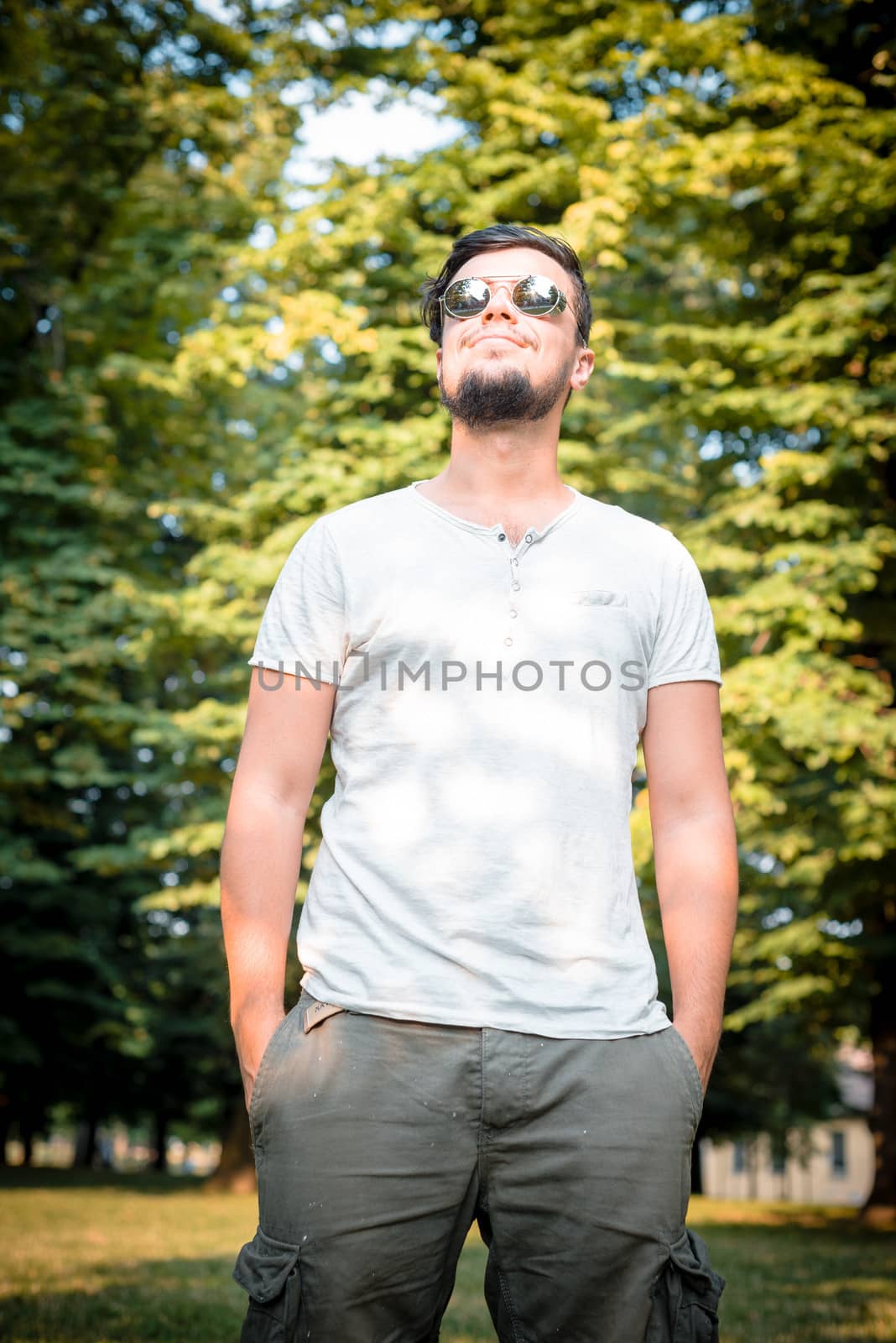 stylish man posing at the park