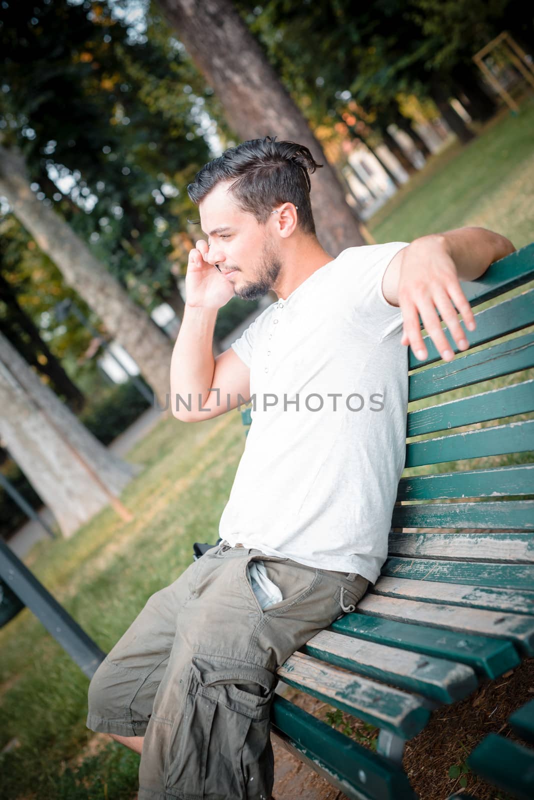 stylish man on the phone at the park