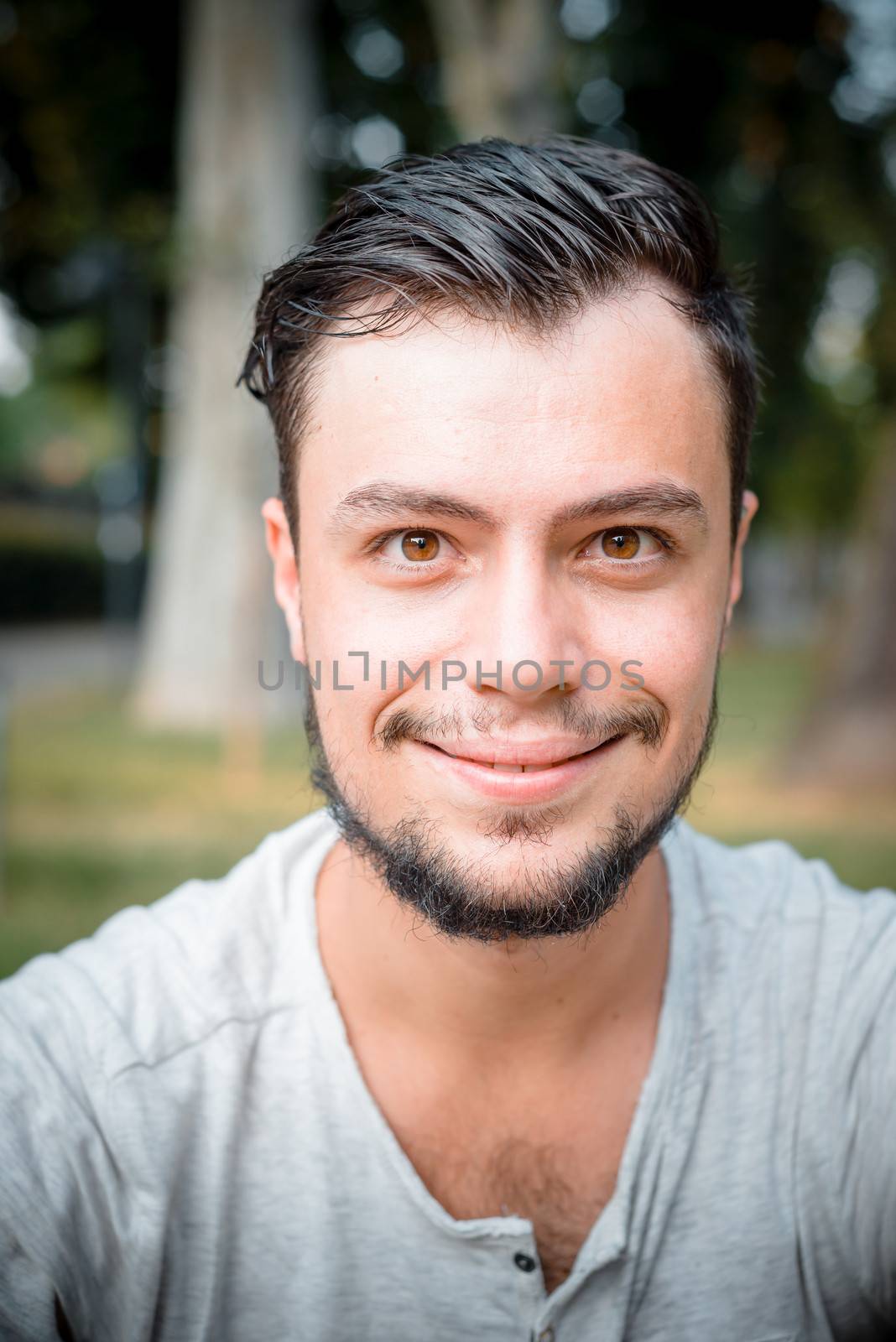close up portrait of youg stylish man smiling
