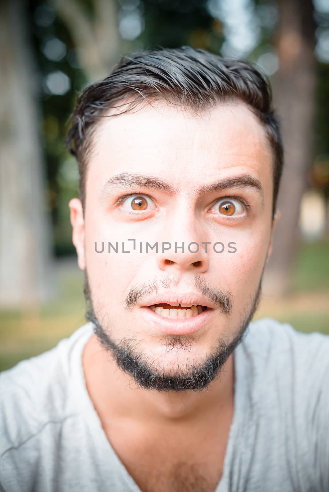 close up portrait of youg stylish man surprised