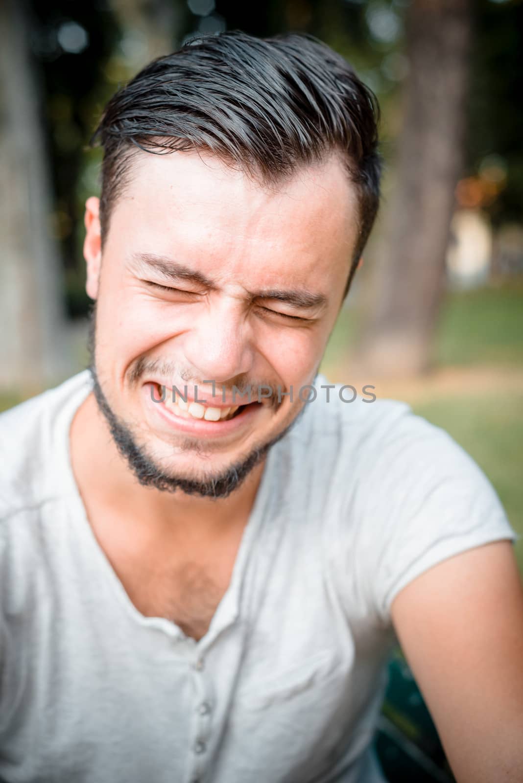 close up portrait of youg stylish man crying