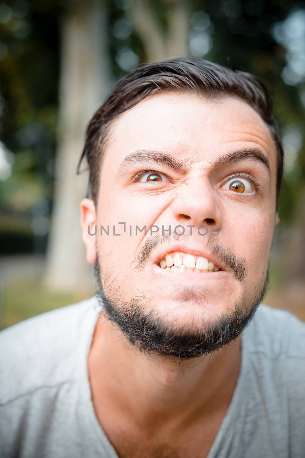 close up portrait of youg stylish man angry