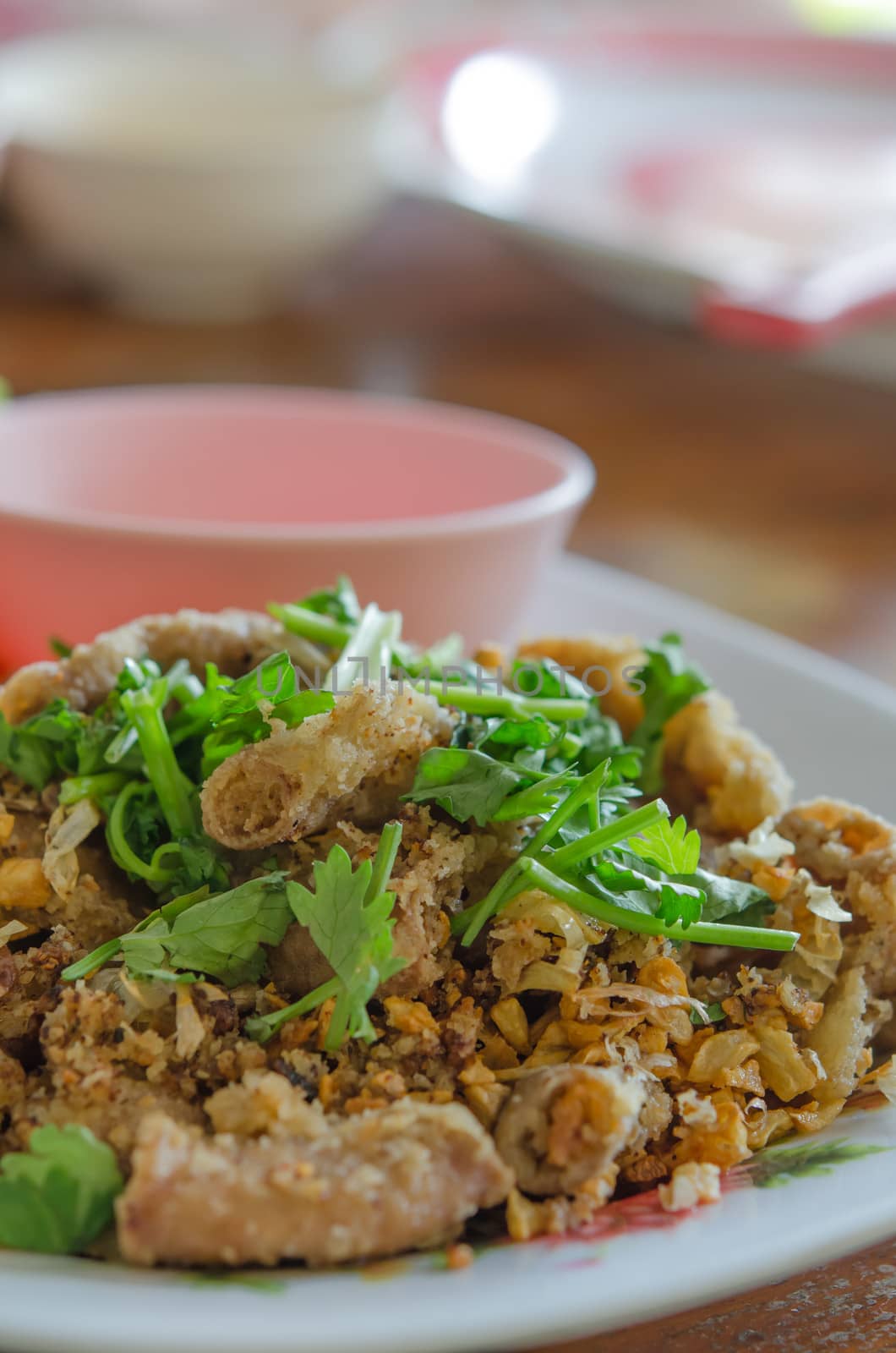 deep fried Pork's colon with garlic served with fresh vegetable