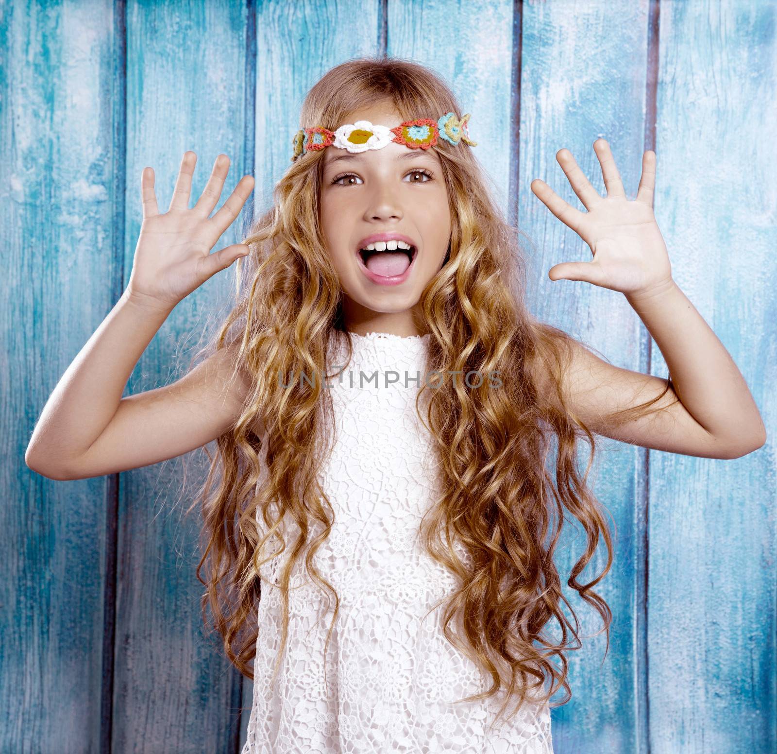Hippie children girl excited open mouth with open hands and raised arms