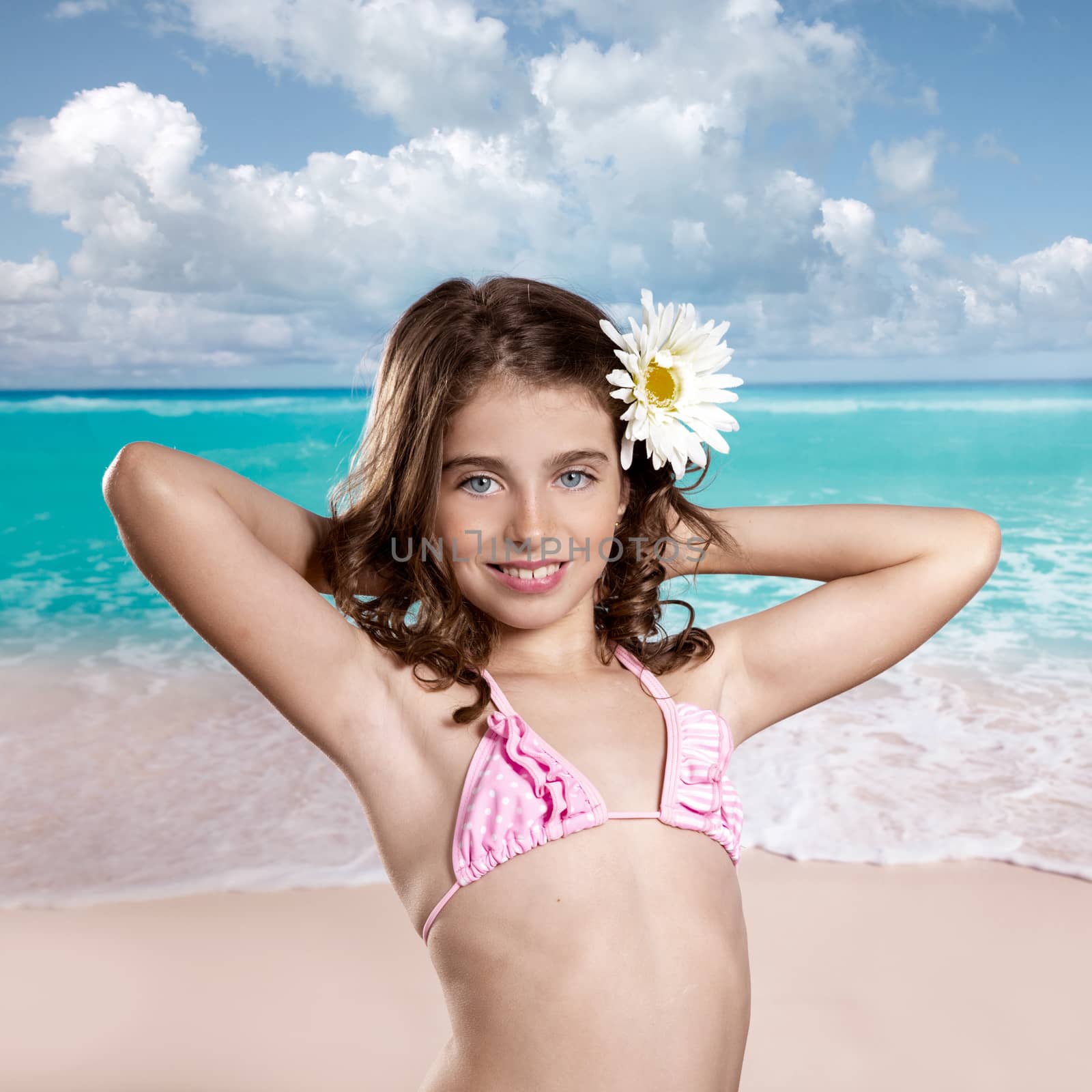 Brunette girl in tropical beach with daisy flower happy for vacation vintage color