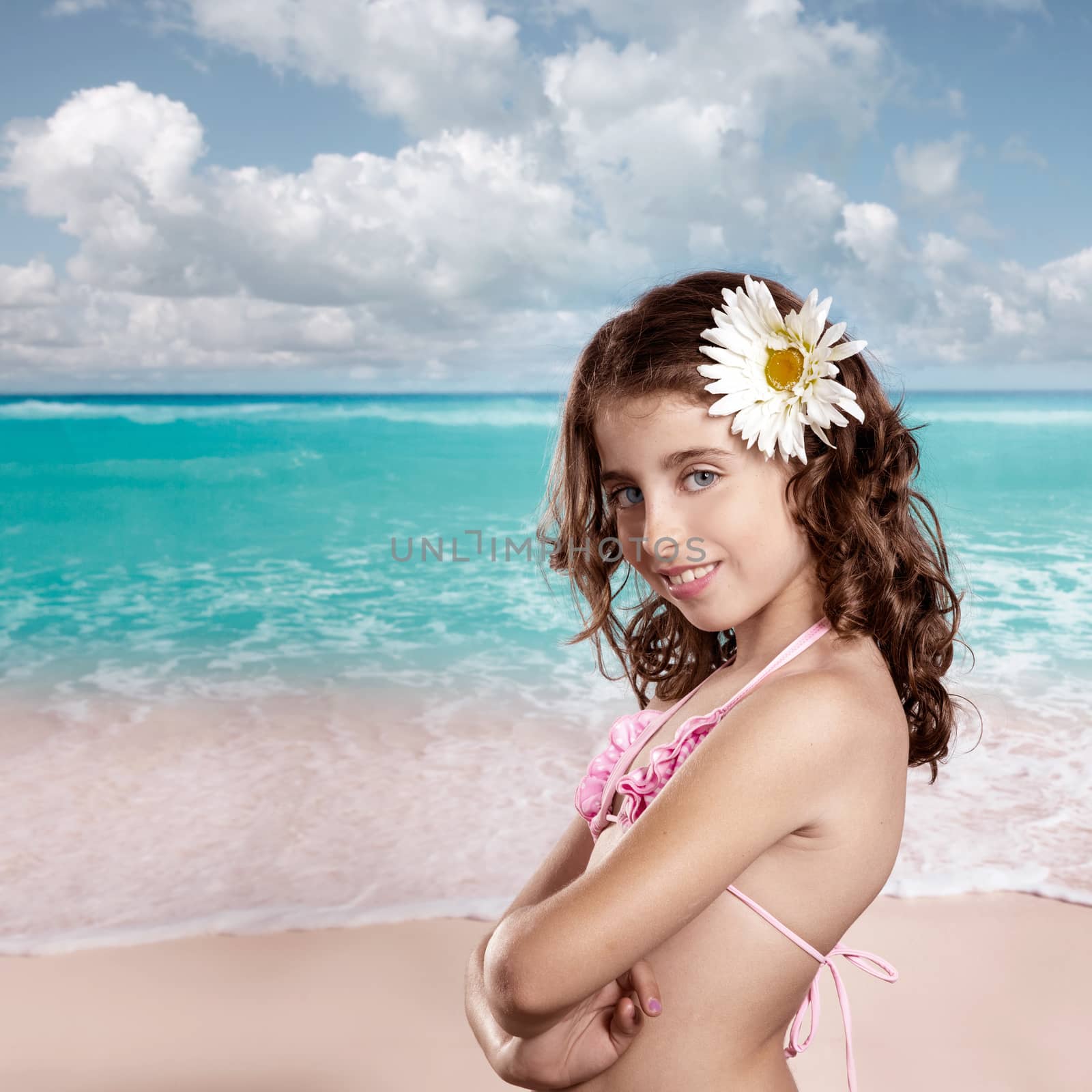 Brunette girl in tropical beach with daisy flower happy for vacation vintage color