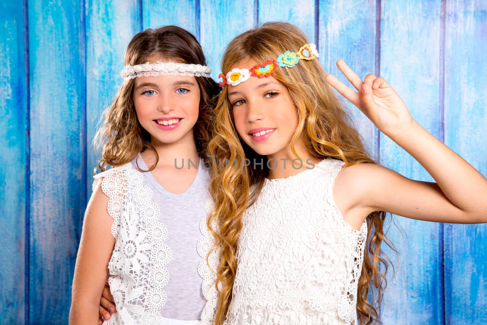 Children friends girls hippie retro style smiling together by lunamarina