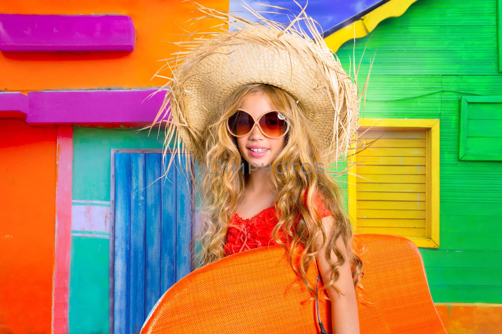 Blond kid surfer girl tropical vacations with sunglasses and beach hat