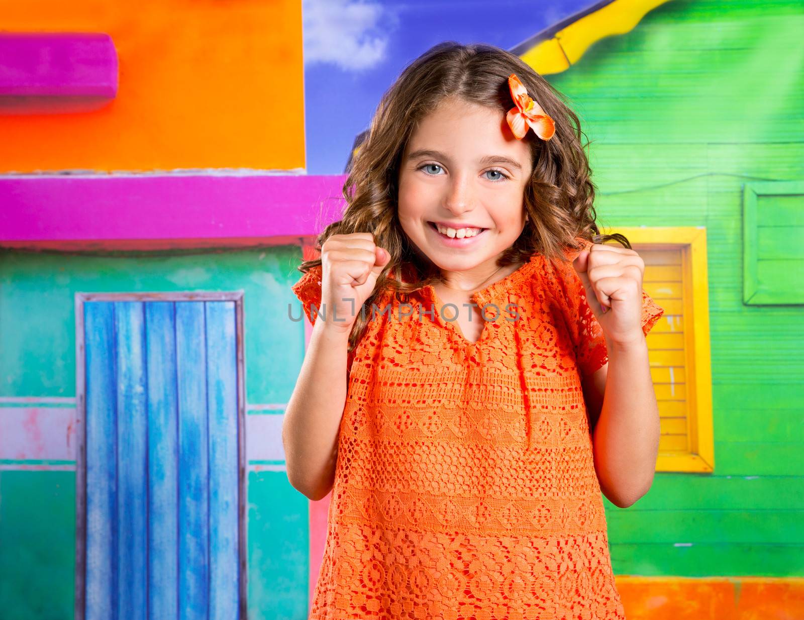 excited happy expression children girl gesture in a tropical colorful house vacation