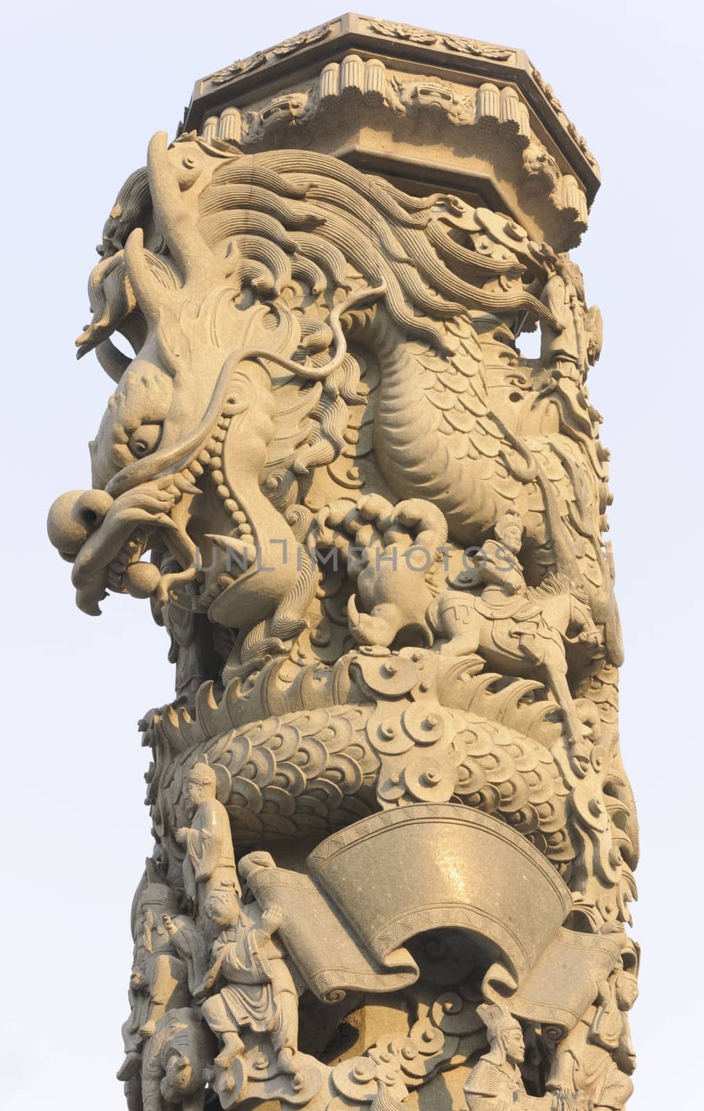 Stone dragon carving pillar in Chinese temple.