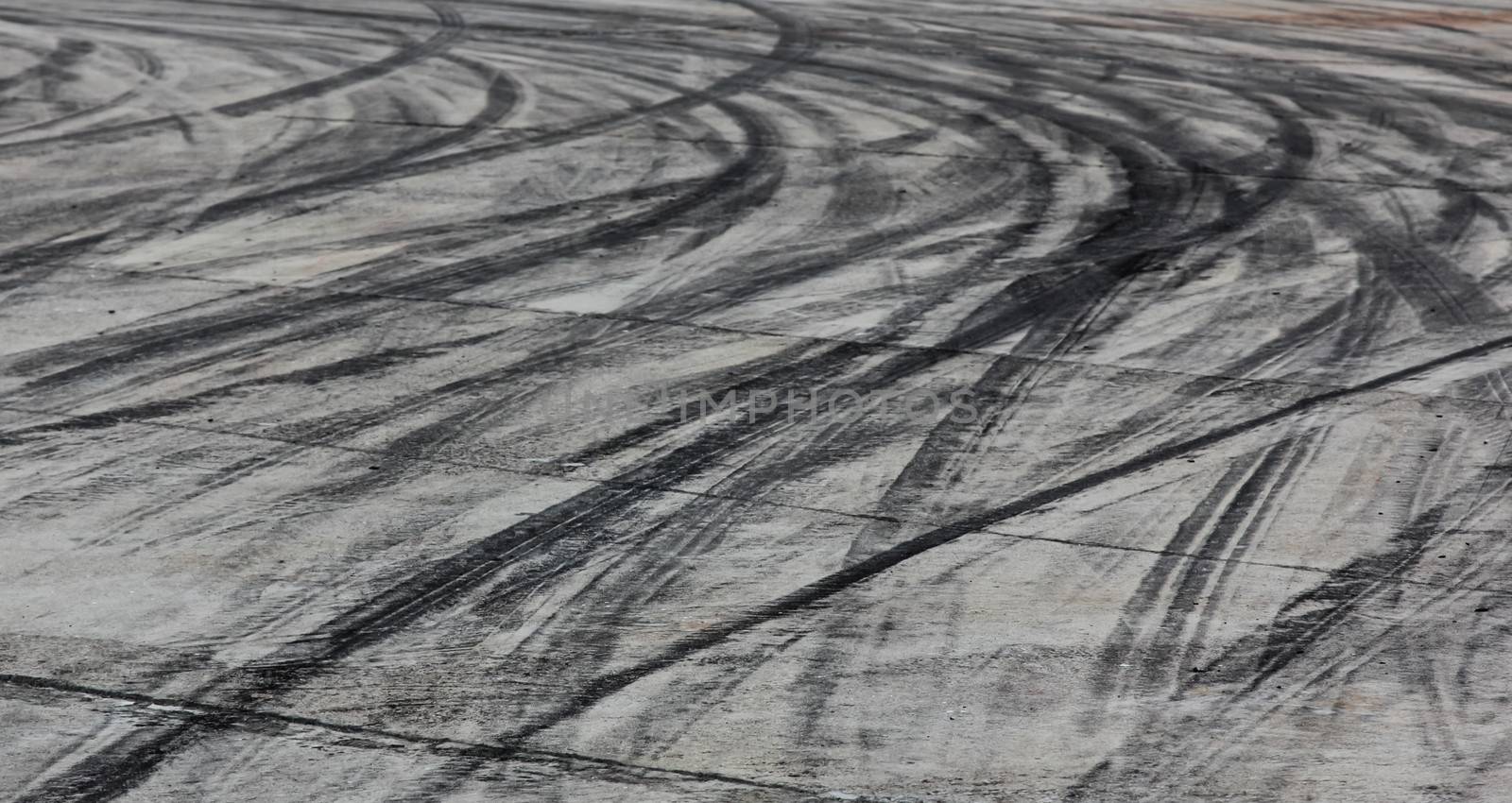 Background with tire marks on road track