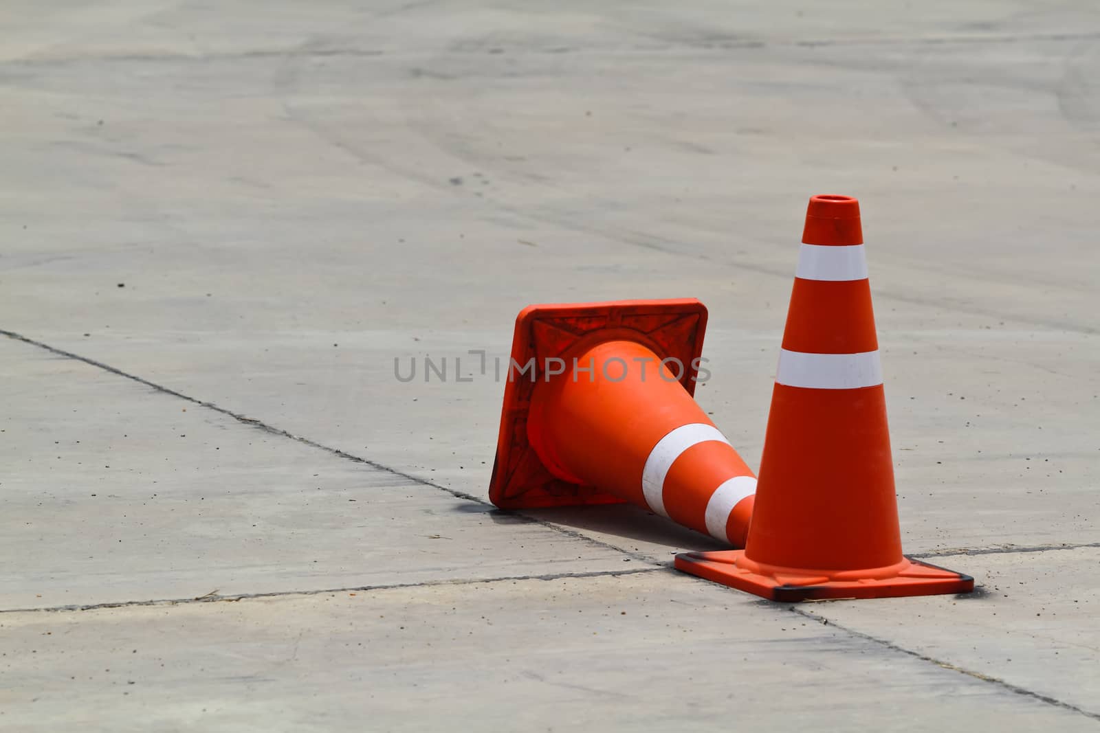 Background with traffic cone on road track