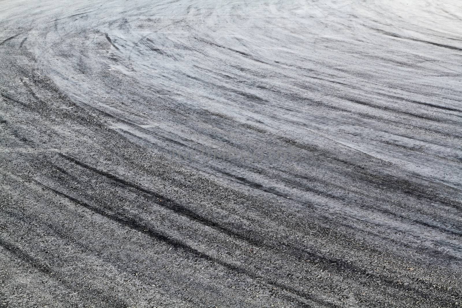 Background with tire marks on road track