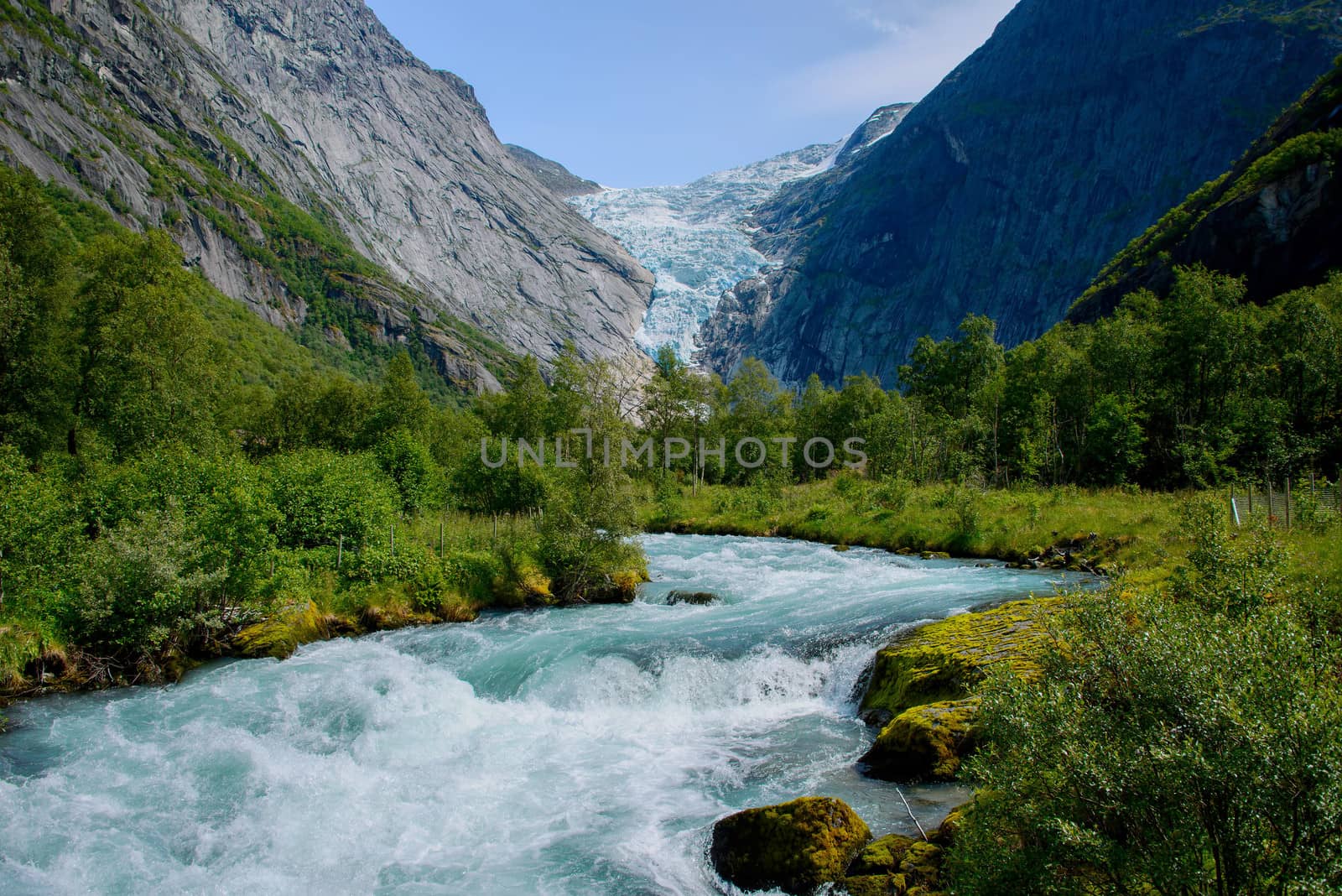 Ice cold water from the glacier Briksdalsbreen in Olden, Norway