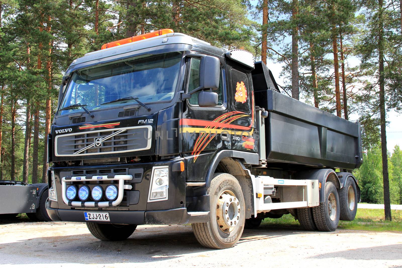 TAMMISAARI, FINLAND - JULY 6, 2013: Volvo FM12 heavy duty lorry parked in Tammisaari, Finland on July 6, 2013. D13K460 is Volvo's first engine to fulfil the demands of new Euro 6 emission regulation coming into force in 2014.