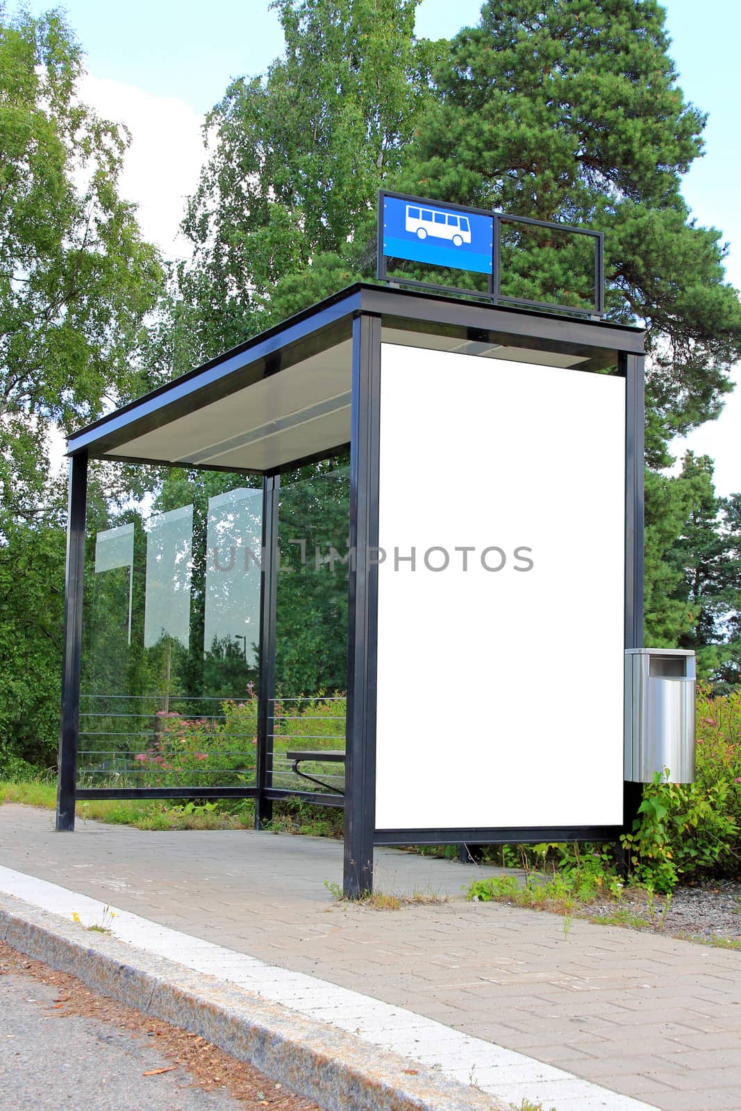 Urban bus stop shelter wth single blank billboard for your advertisement.