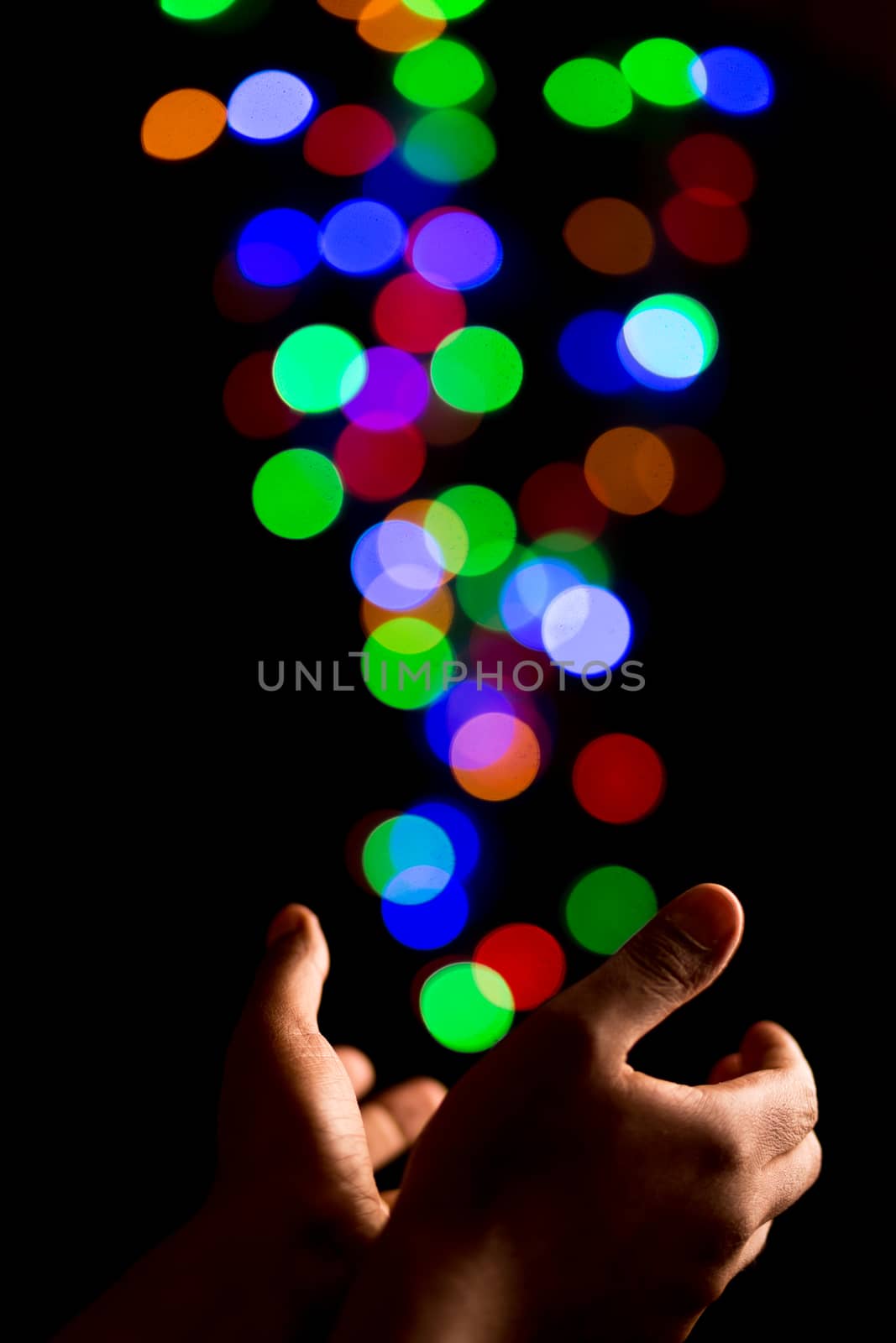 Catching beautiful light bokeh bubbles created by out of focus colorful lights