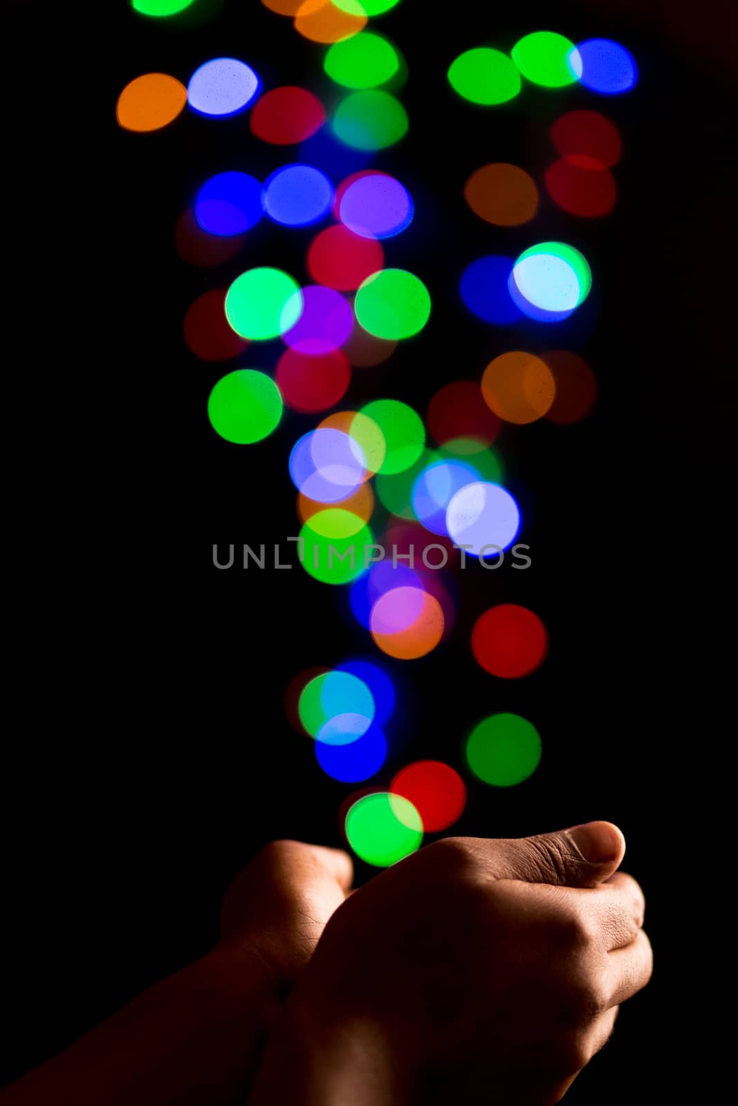 Catching beautiful light bokeh bubbles created by out of focus colorful lights