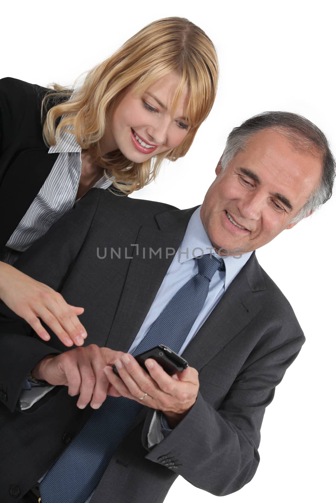 Businessman and his assistant sending an sms