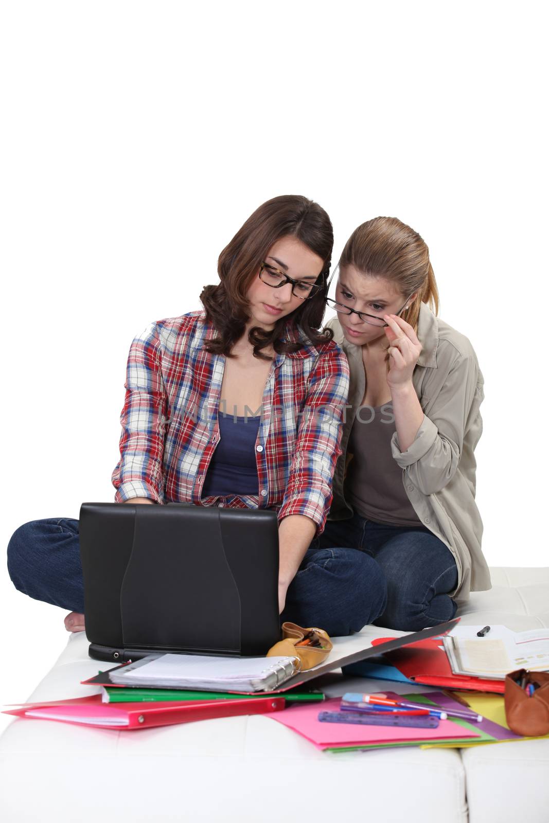 Female students working at a laptop