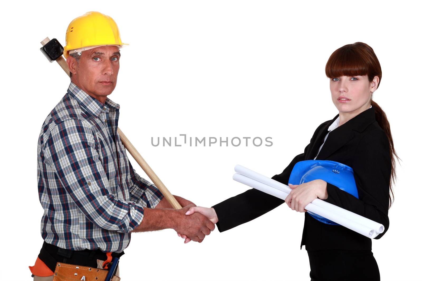 Construction workers handshaking